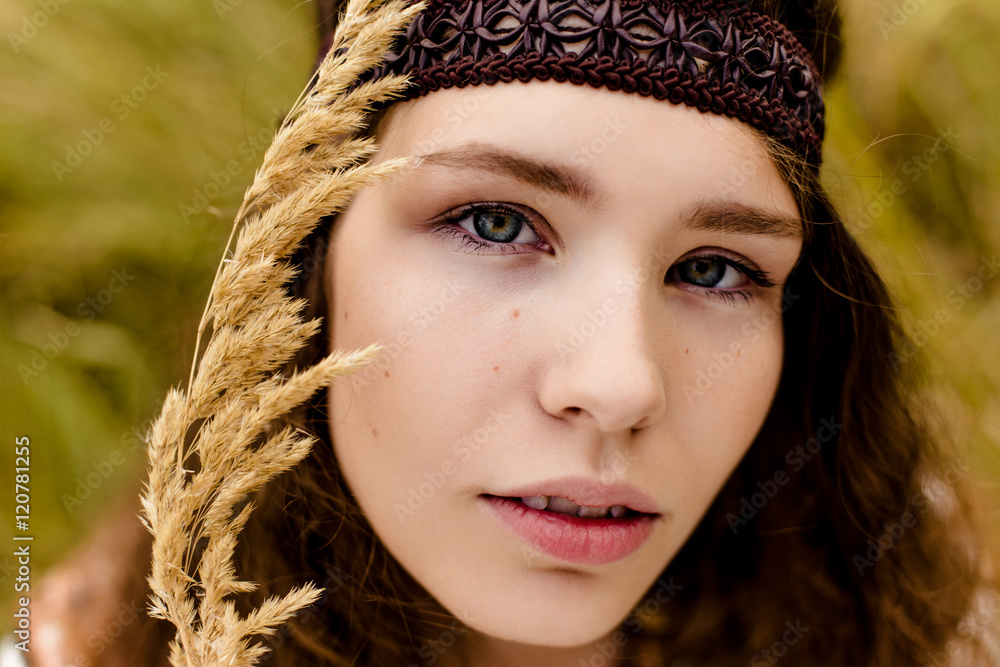 Young girl in ethnic clothes walking in fields. Fashion photo, folklore style Young girl in ethnic clothes walking in fields. Fashion photo, folklore style