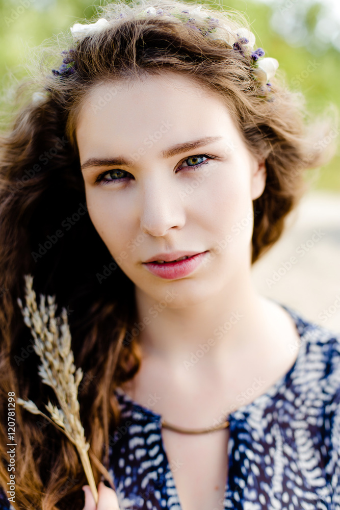 Young girl in ethnic clothes walking in fields. Fashion photo, folklore style Young girl in ethnic clothes walking in fields. Fashion photo, folklore style