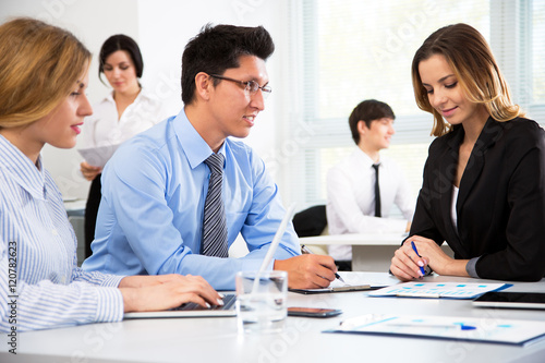 Young businessman with colleagues