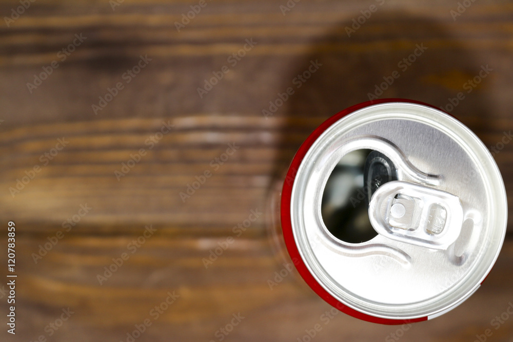 Empty blank soda or beer trash ten on the old wooden background. Red Bank. Empty blank soda or beer trash ten on the old wooden background. Red Bank.