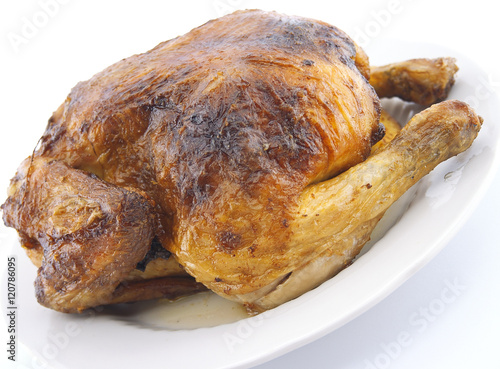 Whole roasted chicken on white background.