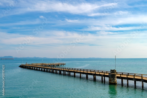 Port ferry boat with concrete ferry pier. Travel inspiration. Tropical landscape over sea with cloudy bright sky  Koh Chang island  Thailand.