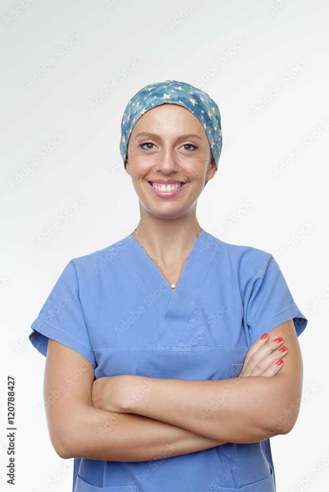 Surgeon with arms crossed looking at camera smiling Surgeon with arms crossed looking at camera smiling