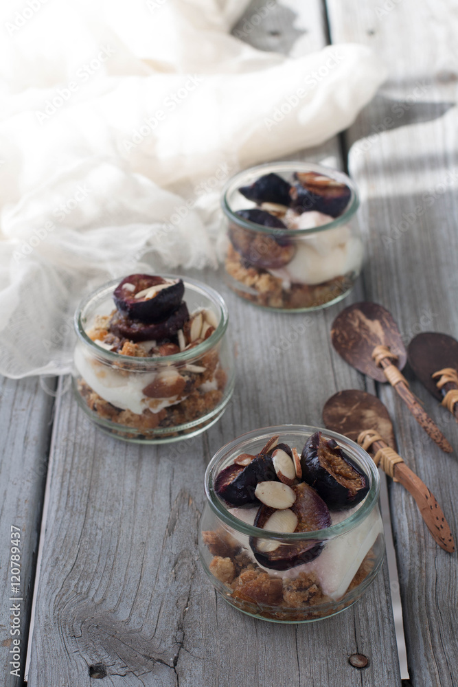 Fototapeta premium Ricotta and roasted fig trifle in mini glass pots 