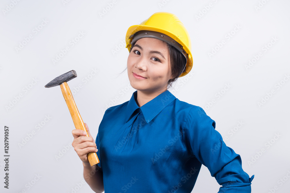 Engineer girl holding a hammer Engineer girl holding a hammer