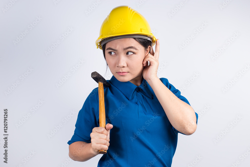 Engineer girl holding a hammer Engineer girl holding a hammer