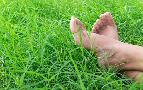 Woman bare feet on green grass, relax and holiday concept © mraoraor