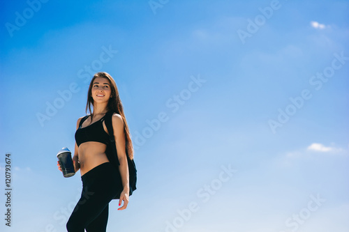 Fitness girl with a shaker