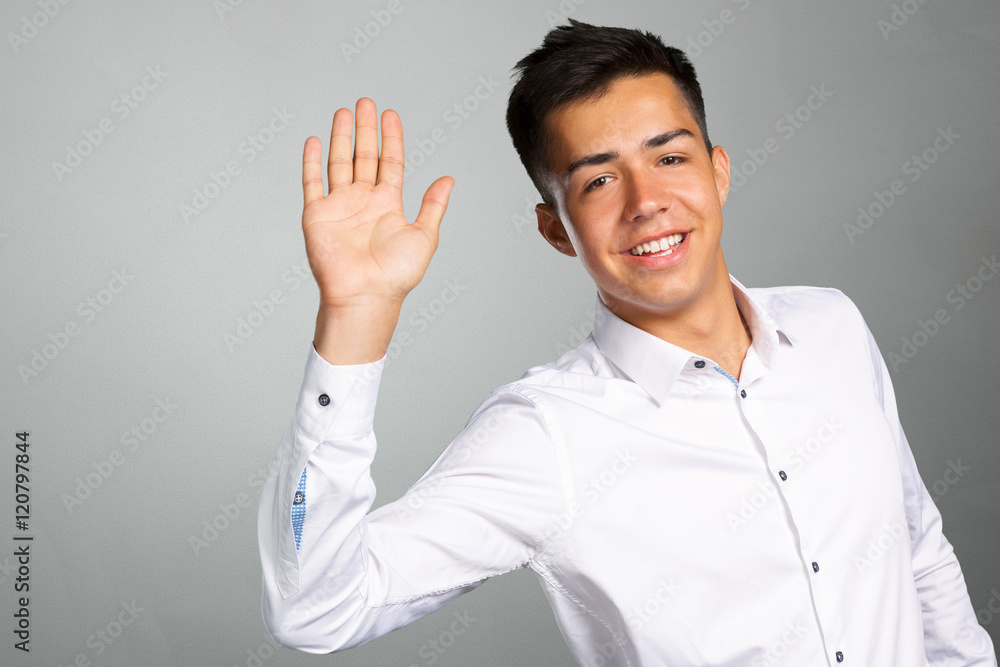 Portrait of a young man giving you high five Portrait of a young man giving you high five