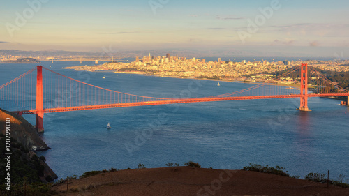 Golden Gate Bridge and downtown San Francisco at sunset