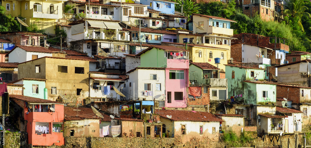 Slum with colorful houses on the hill by the sea in the city of Salvador in Bahia, Brazil