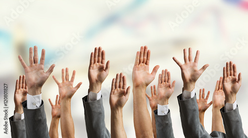 Group of people with raised hands