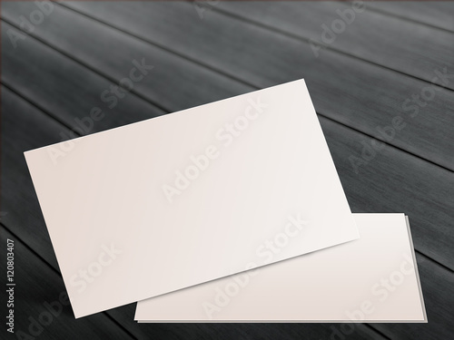 Blank name cards on wooden background