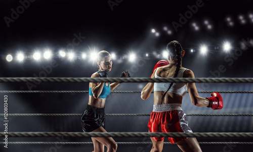 Girls boxing in ring . Mixed media