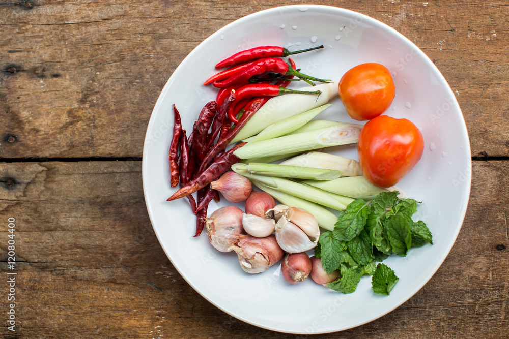 Spices and herbs in a white dish. Table Brown Spices and herbs in a white dish. Table Brown