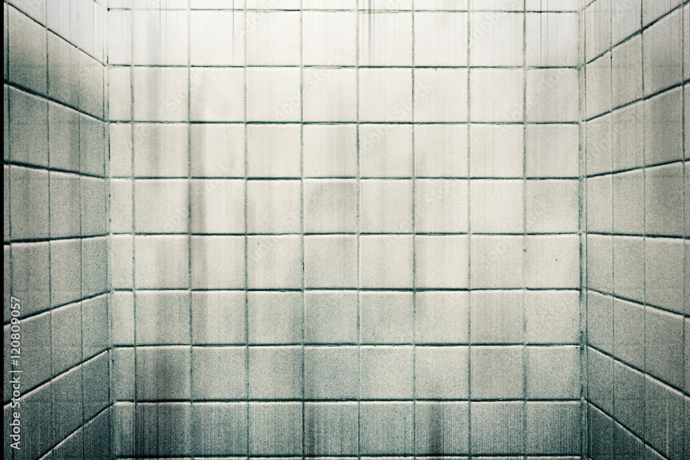 Dirty grain white marble tiles wall in bathroom for texture background