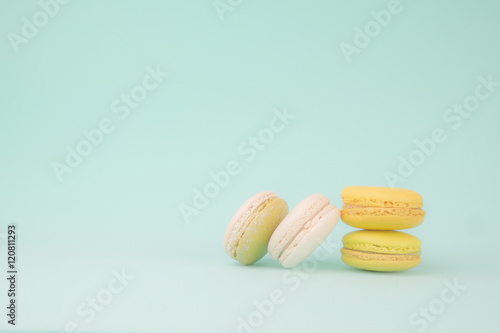 Sweet and colourful french macaroons on retro vintage background