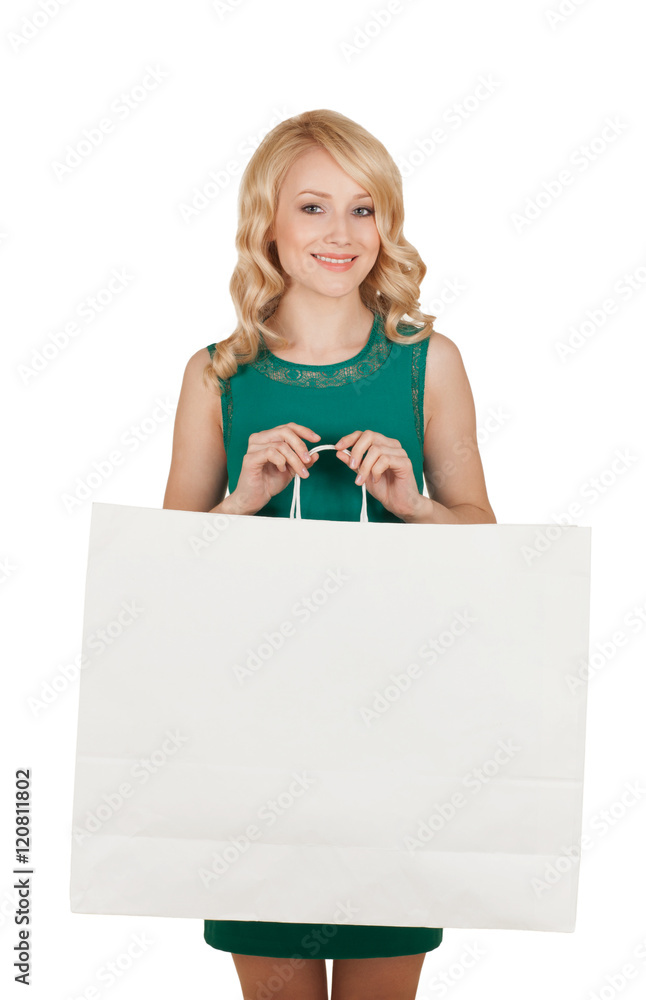 the beautiful blonde in a green dress holds a big package with purchases the beautiful blonde in a green dress holds a big package with purchases