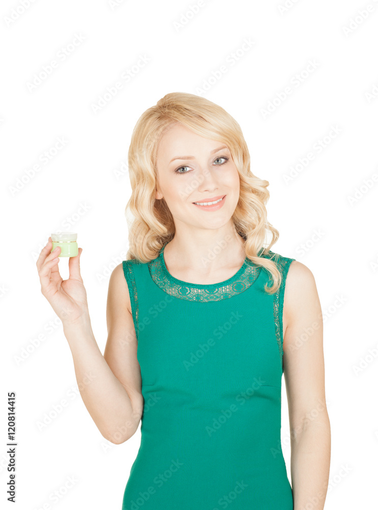 the beautiful blonde holds a cream jar in a hand the beautiful blonde holds a cream jar in a hand
