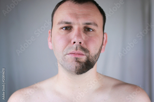 bearded man shaving