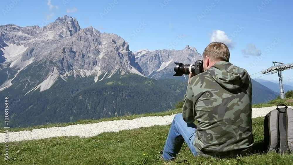 Photographer taking photos in the mountains Photographer taking photos in the mountains