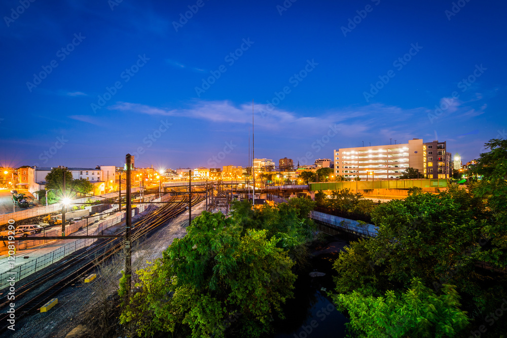 Jones Falls and a rail yard at night, seen from the Howard Stree