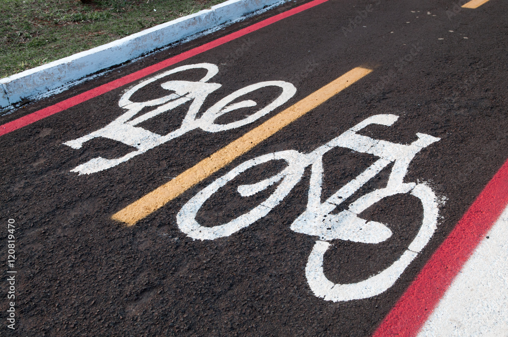 Obraz premium Signs on the ground for cyclists. bike lane track. Right to come and go cycling only. Exclusive lane for cyclists.