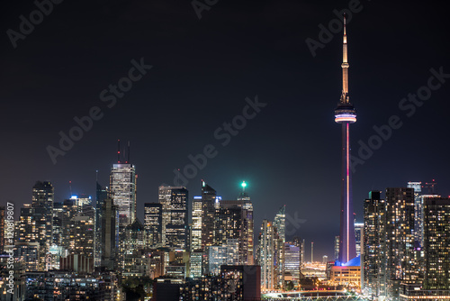 Urban lighted landscape of Toronto.   A balcony view of  lighted streets, parks, buildings and office towers on a hot & humid August night in capitol of Ontario, Canada.