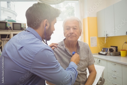 Male doctor examining a patient