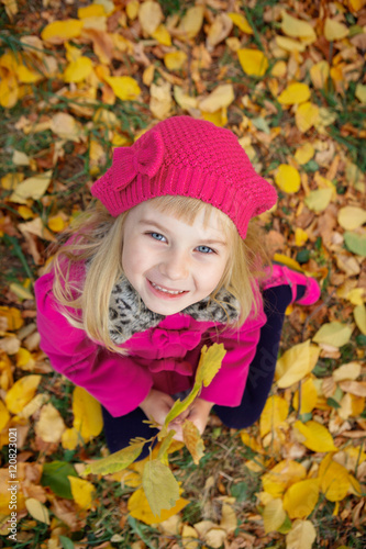 Girl having fun in autumn park