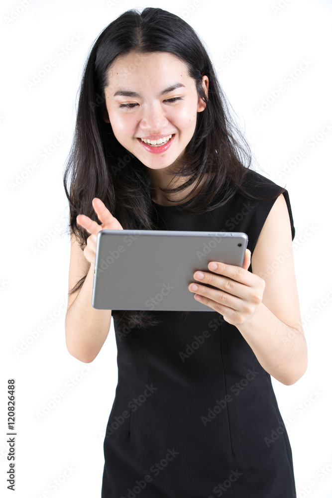 Asian lady chatting using a tablet Asian lady chatting using a tablet