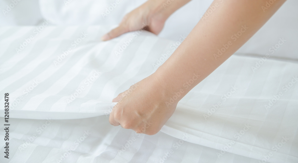 Hands Making Bed from Hotel Room Service Hands Making Bed from Hotel Room Service