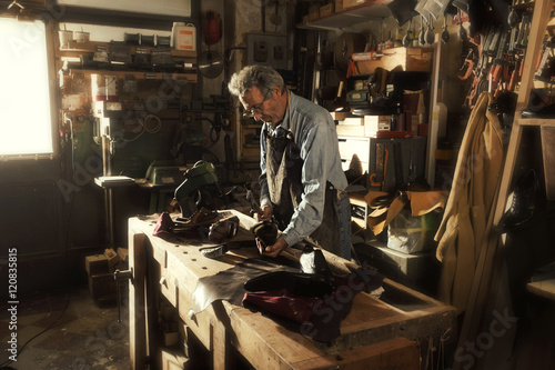 craftsman making luxury handmade man shoes photo