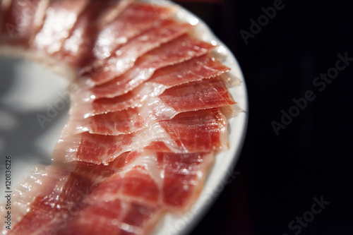 decorated arrangement of iberian cured ham on plate
