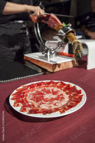 Master slicer cutting iberian cured ham