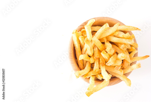 French fries in wood bowl on white background. Top view with copy space