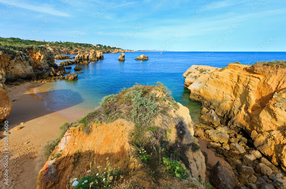 Yellow cliffs on beach (Algarve, Portugal).