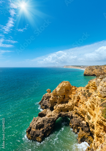 Fototapeta Naklejka Na Ścianę i Meble -  Sunshine above Atlantic rocky coastline (Algarve, Portugal).