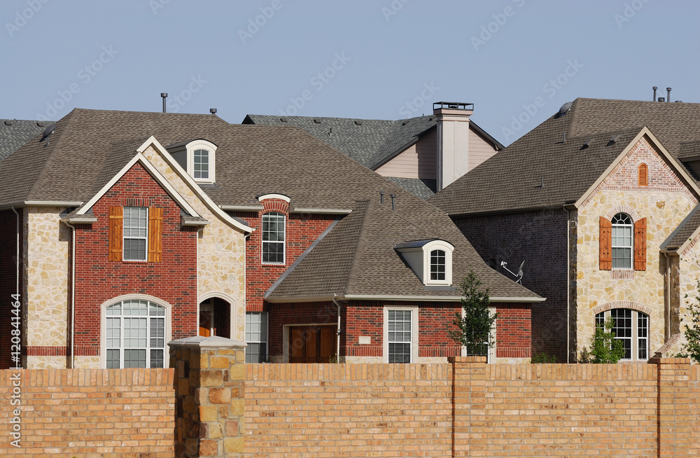 townhouses in residential community with wall surrounded