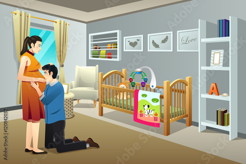 Pregnant Woman with Her Husband in the Nursery Room