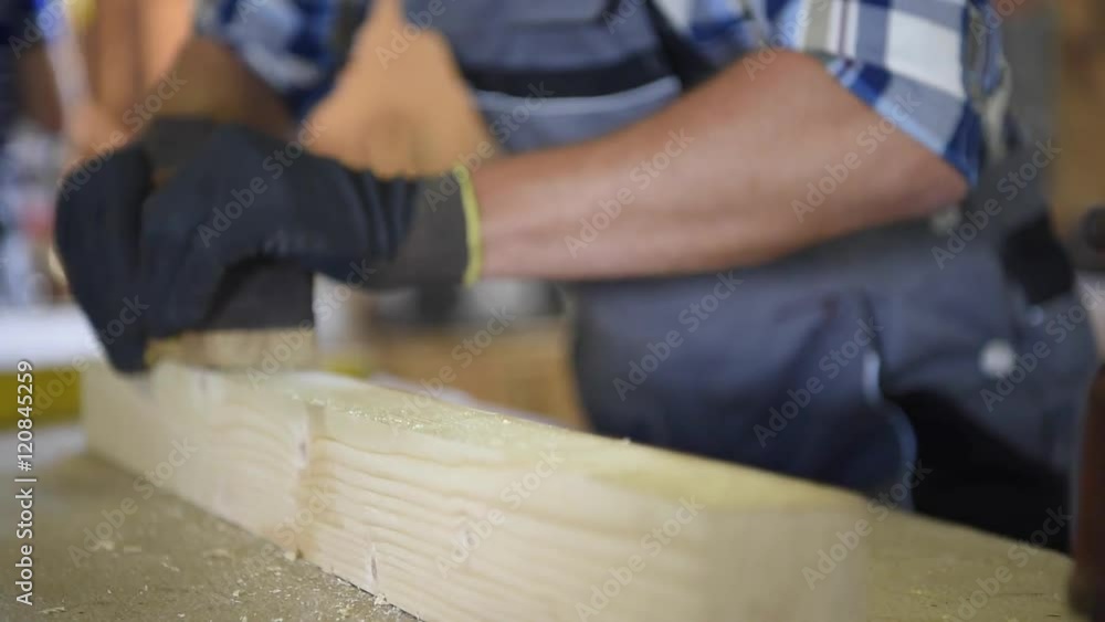 Closeup of carpenter's hands working wood Closeup of carpenter's hands working wood