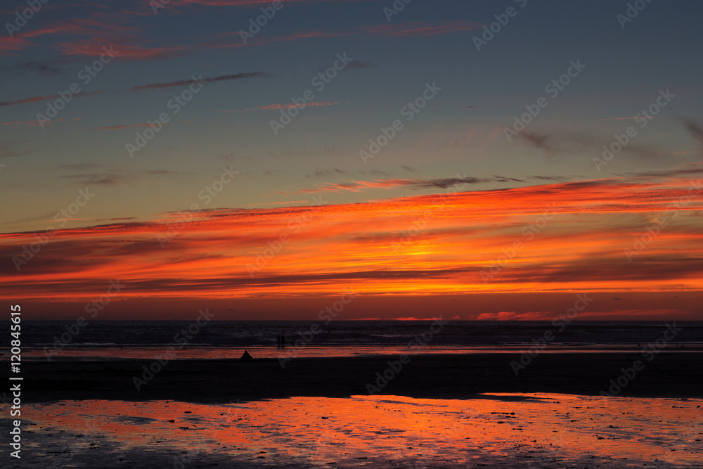 Colourful sunset over the beach at Polzeath