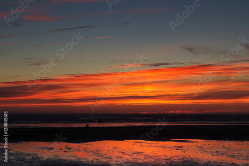 Colourful sunset over the beach at Polzeath
