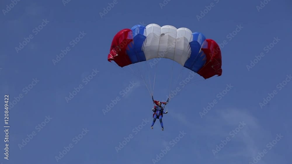 parachutist in the blue sky