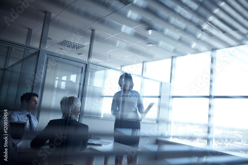Silhouettes of business people meeting in dark room