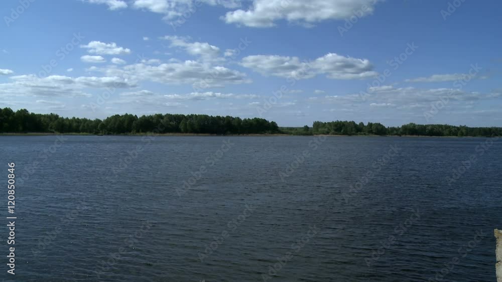 Spring landscape - lake and forest on shore Spring landscape - lake and forest on shore