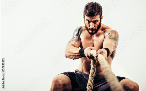 Athlete pulls a rope