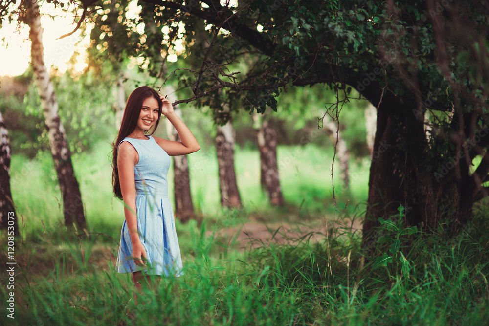 Portrait of pretty girl near the tree in the park. Concept of youth and natural beauty. soft focus Portrait of pretty girl near the tree in the park. Concept of youth and natural beauty. soft focus