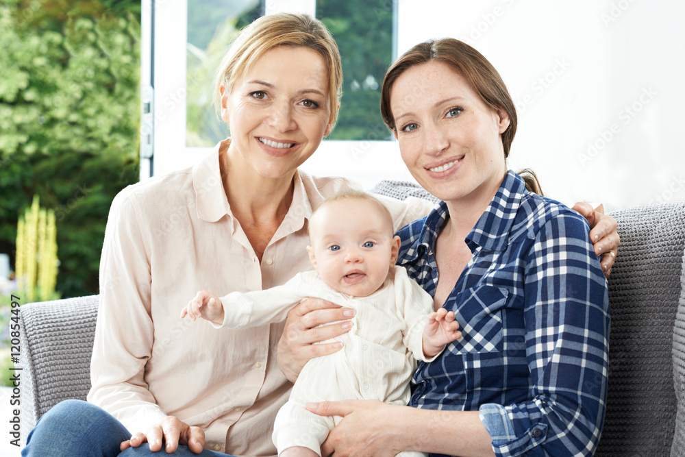 Obraz premium Portrait Of Mother With Adult Daughter And Baby