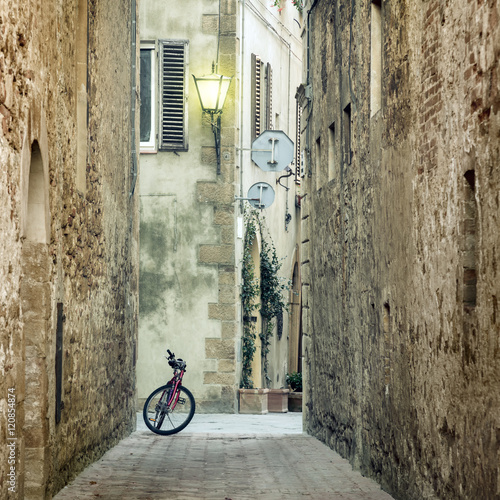 Fototapeta Naklejka Na Ścianę i Meble -  Old Mediterranean Town street with retro bike